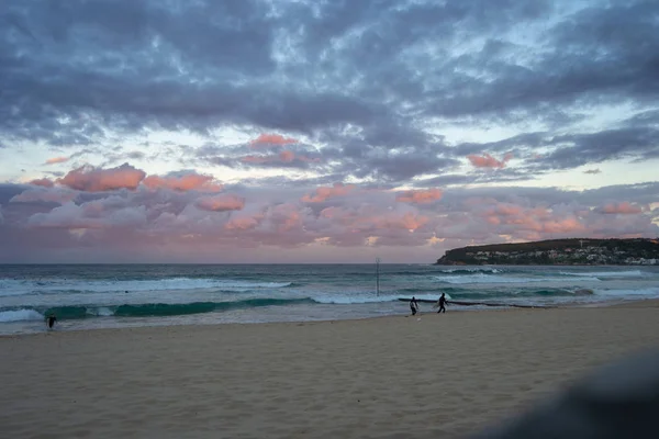 Beautiful sunset at the beach pink and blue colors