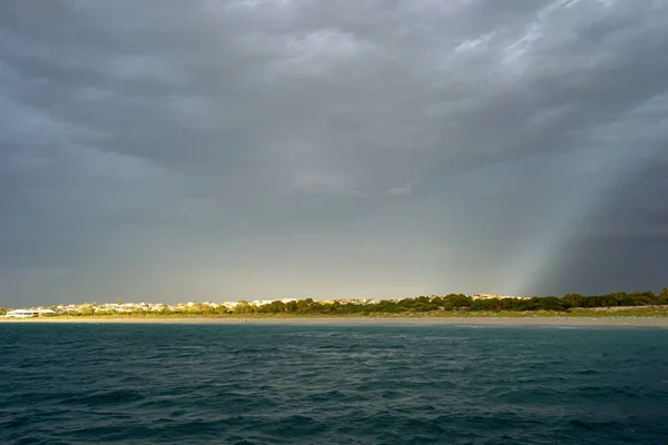 Landscape of the beach cloudy and rainy with sun light