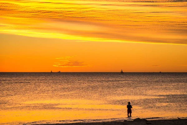 Landscape of silhouettes persons orange colors and contrast