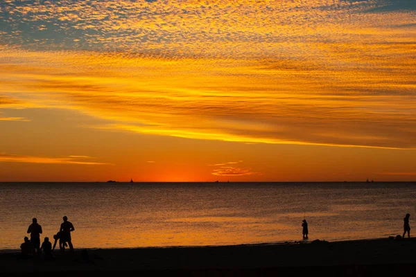 Landscape of silhouettes persons orange colors and contrast