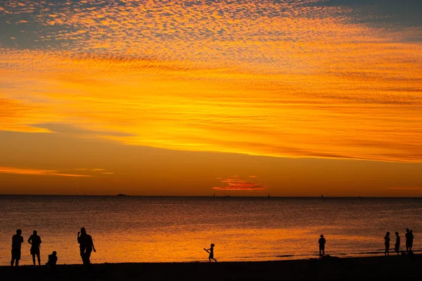 Landscape of silhouettes persons orange colors and contrast