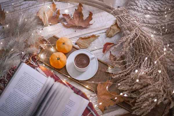 fall cozy day with cup of coffee, book