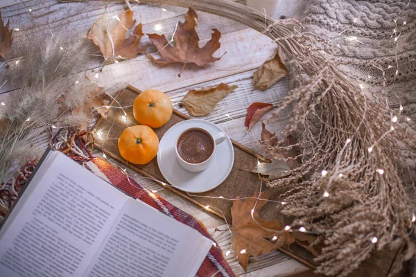 fall cozy day with cup of coffee, book