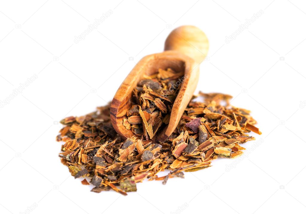 Alder buckthorn bark in wooden scoop. Buckthorn herbal tea is used as a laxative.
