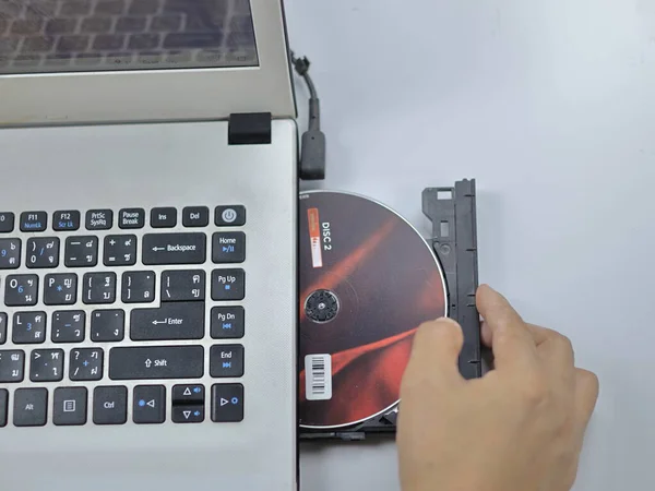 A CD-ROM or DVD drive is used to read and sometimes write data to a disc.