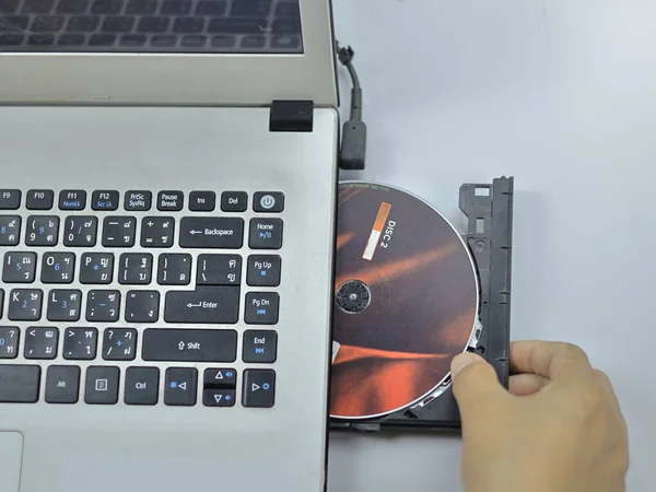 A CD-ROM or DVD drive is used to read and sometimes write data to a disc.