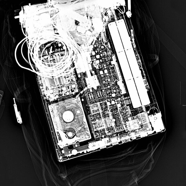 This image is an X-ray photograph of a laptop, part of a series by commercial and fine art photographer Andrei Duman titled "Beyond the Surface: The Art of X-rays".