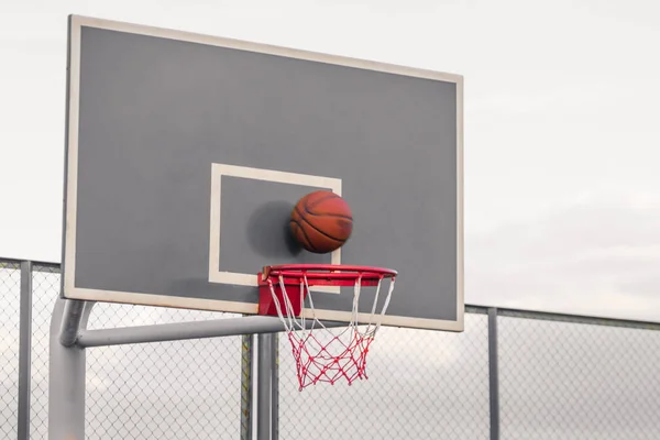 Platform for basketball competitions. A basketball hits the shield and flies into the basket. Workout on the street. The concept of winning the game