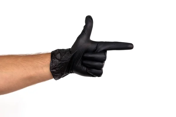 用黑色橡胶手套在白色背景上显示一把枪 手势举起手来 工作的概念厨师 外科医生 — 图库照片
