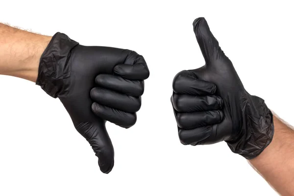 两个男性手在黑色手套显示手势与他们的拇指和拇指下来 — 图库照片