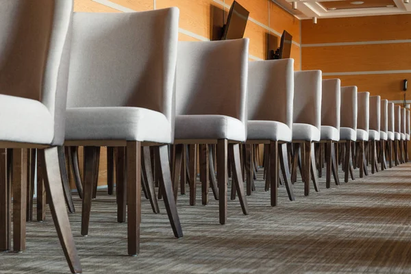 Gray Textile Chairs Brown Wooden Legs Stand Straight Line Empty — Stock Photo, Image