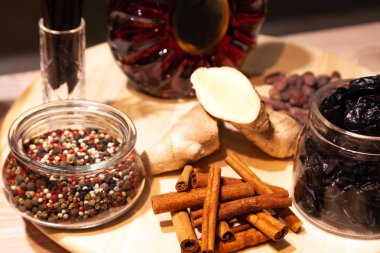 Russia Kemerovo 16-11-2018 degustation luxury cognac in crystal bottle Remy Martin XO at buffet table, ginger, prunes, peppers mix, ginger, cinnamon sticks. Concept promotion Remy Cointreau