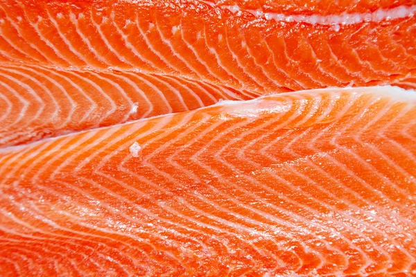 Closeup fresh norwegian salmon fillet fish on professional resta