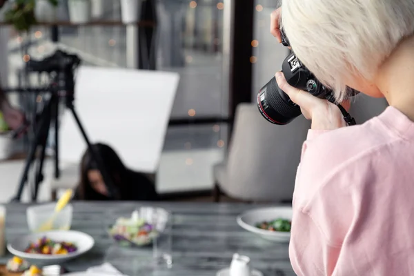 Russia Kemerovo 2019-03-10 girl photographer taking pictures on