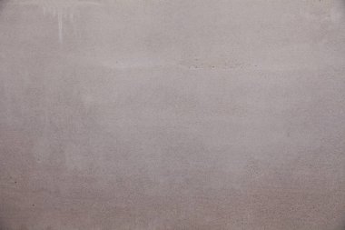 Doku arka planı. Sert dikişli gri beton duvar, havan topu,