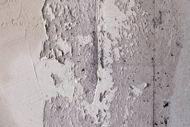 Doku arka planı. Sert dikişli gri beton duvar, havan topu,