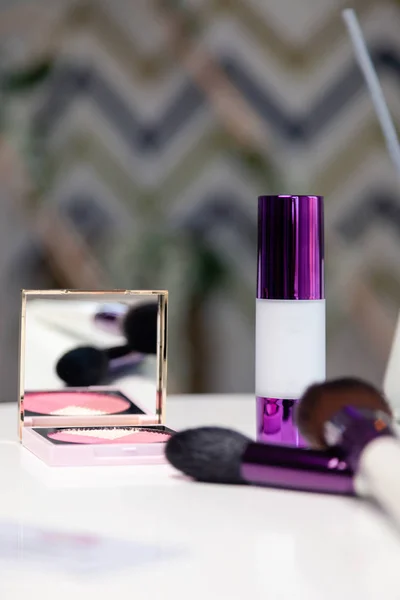 Closeup decorative female cosmetics for make-up, blush, mirror
