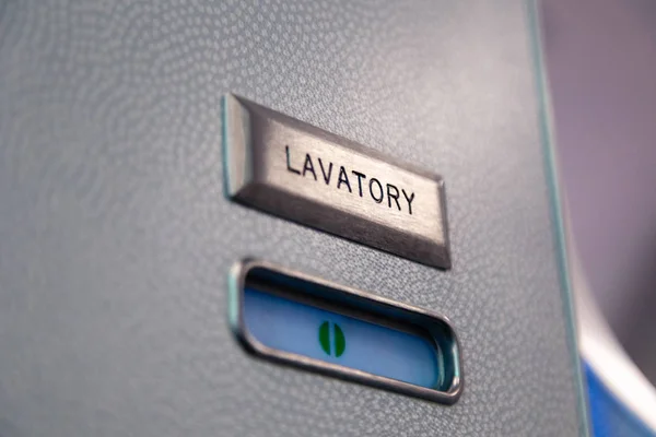 Vacant green sign, vacant symbol on an airplane lavatory door. R