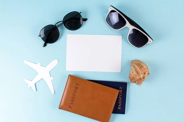 Sea Shell Airplane Passports Sunglasses Blue Background — Stock Photo, Image