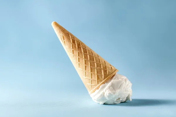 sweet white ice cream on pastel blue background