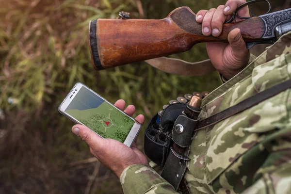 Search for a hunter while hunting geolocation and location. Phone navigation. Hunting, navigation, location concept