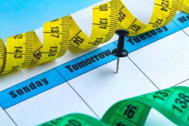 Motivasyon kavramı. Bir diyet planlama, spor, kendini geliştirme, sağlık ve başarı yarın için çalışıyor. Yarın ve Pazartesi kavramı. 