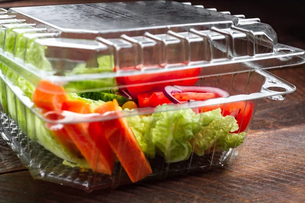 Healthy, dietary, healthy meal in a plastic container. Lose weight, eat right. Snack at work, in the office at lunch time, during a break. Lunch box