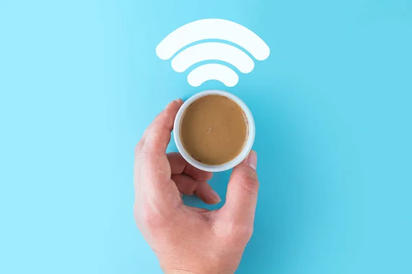 Coffee concept. Free wi-fi and internet. Awakening, fresh, hot coffee on a blue background. Wi-fi concept.