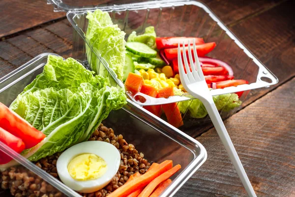 Healthy, dietary, healthy meal in a plastic container. Lose weight, eat right. Snack at work, in the office at lunch time, during a break. Lunch box