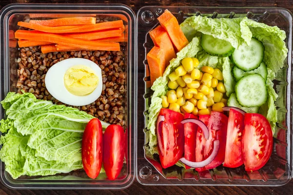 Dietary, healthy meal in a plastic container. Eat right concept. Snack at work, in the office at lunch time, during a break. Lunch box. Healthy food and nutrition concept