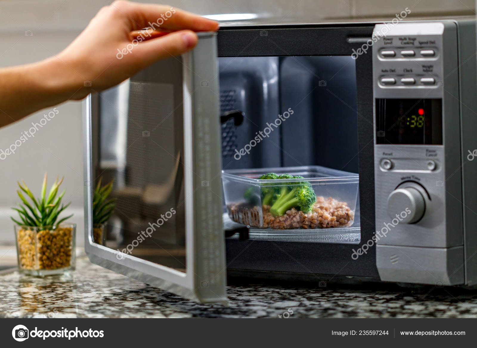 Using Microwave Oven Heat Food Heating Plastic Container Broccoli Buckwheat Stock Photo by