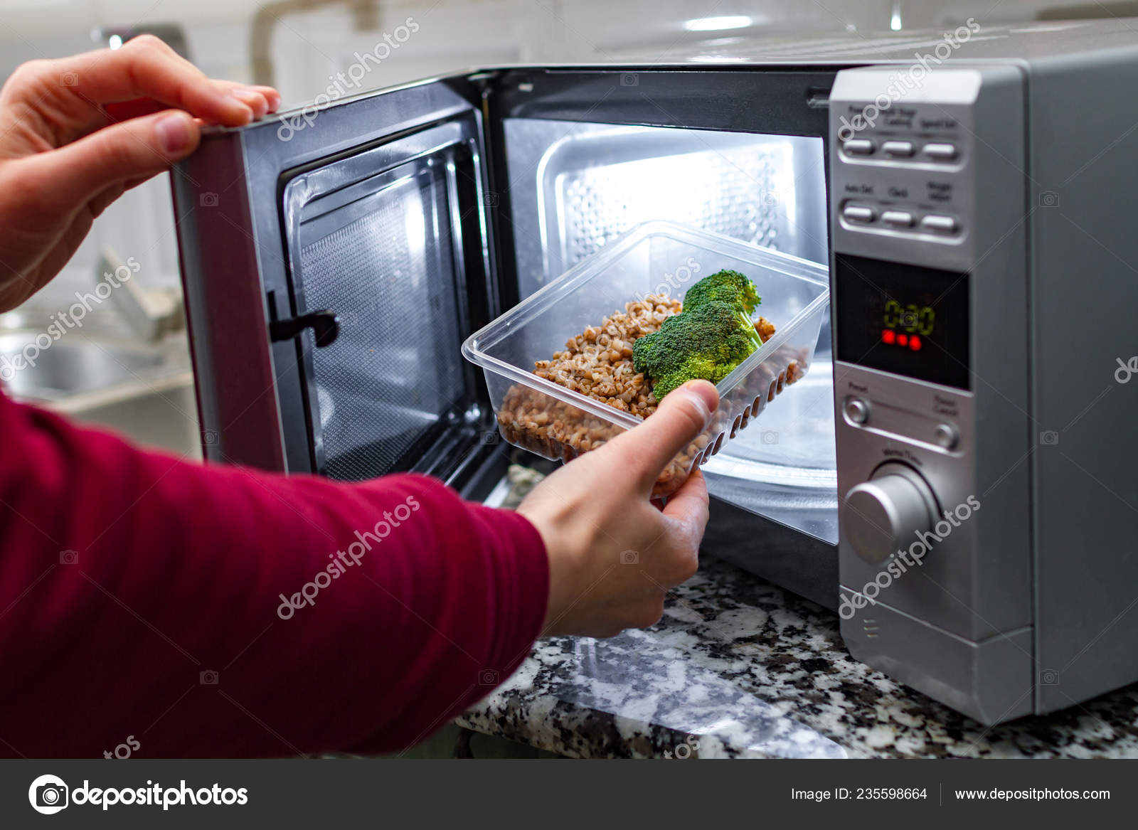 Using Microwave Oven Heat Food Woman's Hand Puts Plastic Container Stock  Photo by ©goffkein 235598664