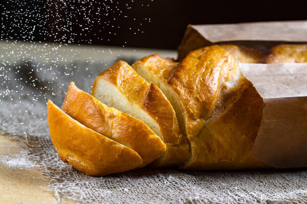 Long loaf from the bakery on the table. Bakery products. Bread from rye, wheat flour