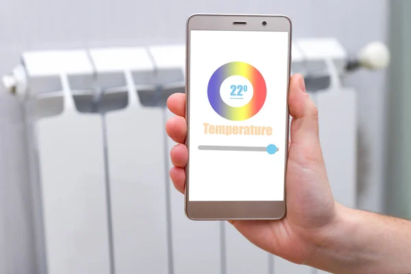 House heating with central heating. Temperature control on the radiator in the apartment on smartphone. Thermostat. Smart home