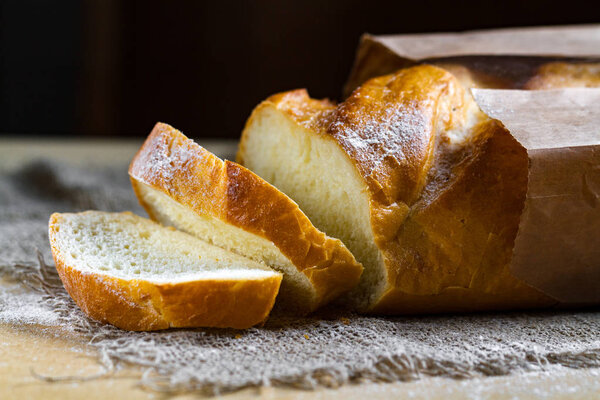 Long loaf from the bakery on the table. Bakery products. Bread from rye, wheat flour