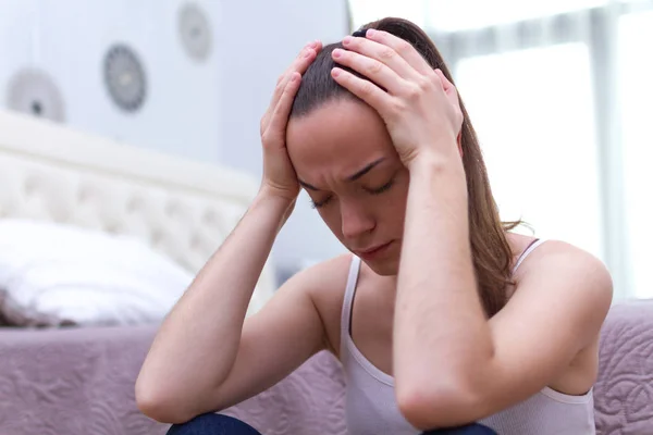 Stressed Young Woman Sitting Alone Floor Room Holding Her Temples — Stock Photo, Image