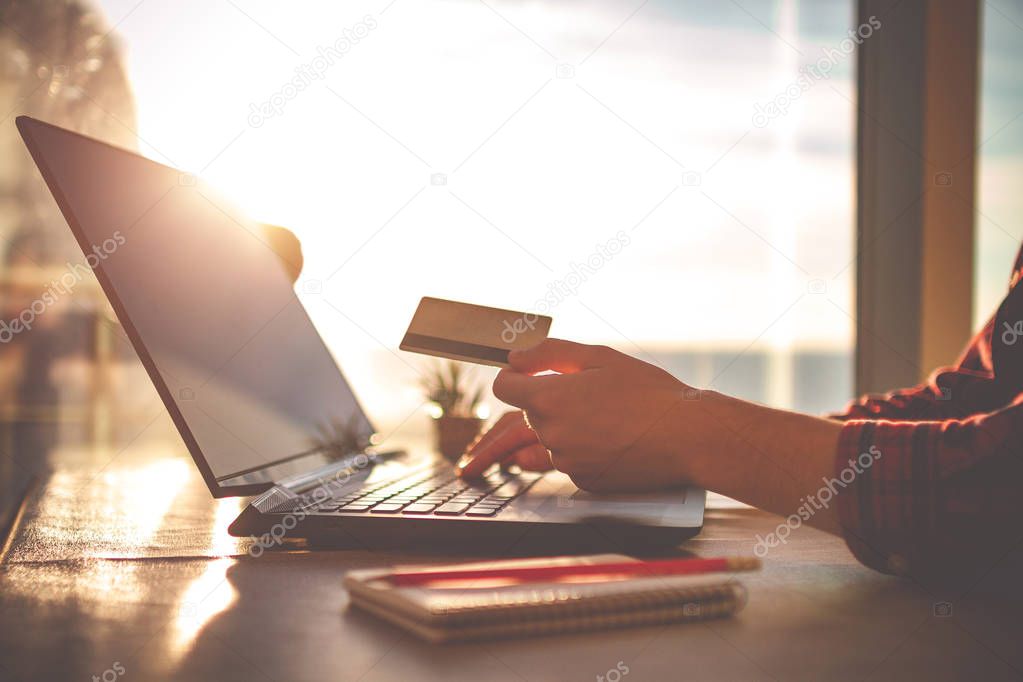 Online shopping and online payment for purchases, goods by credit card with using a laptop. Order goods online