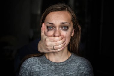 Portrait of a crying woman after beating by her husband. Female violence concept. Help for women suffering from domestic, woman violence. Social and life problems clipart