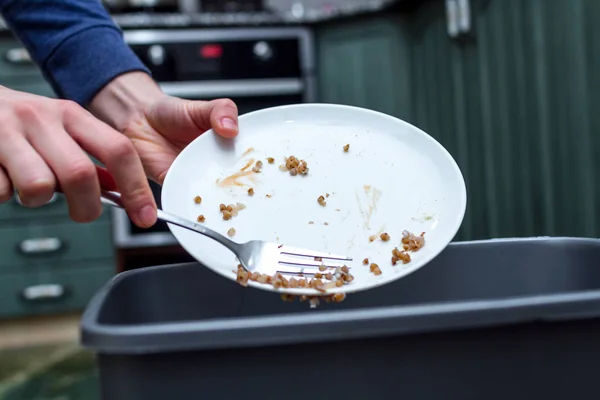 Close Person Throwing Plate Leftover Buckwheat Trash Bin Scraping Food — Stock Photo, Image