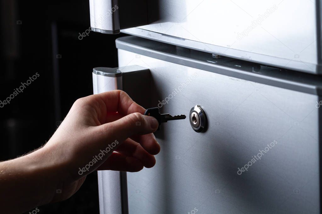 Metal refrigerator door with lock. Food storage and freezing. Diet 