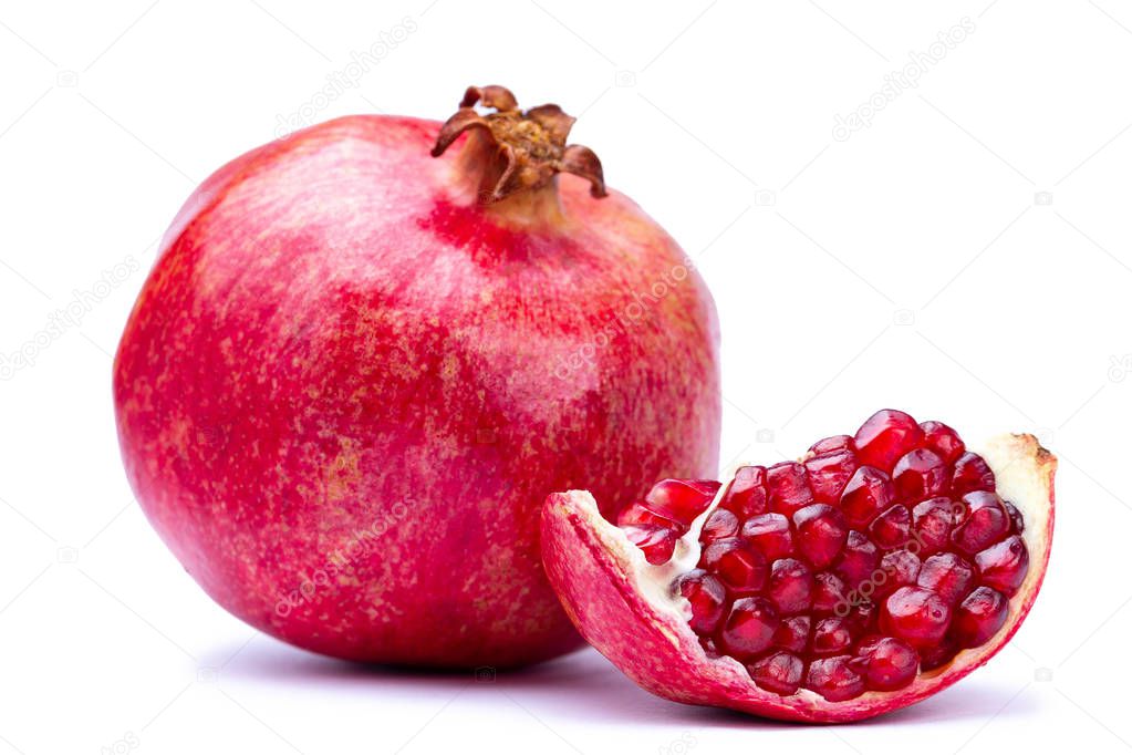 Ripe pomegranate and clipping path with red seeds isolated on white background 