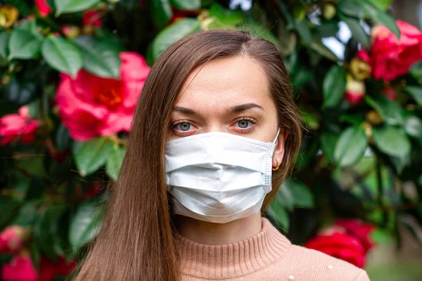 Portrait of allergy woman in medical mask suffering from allergi