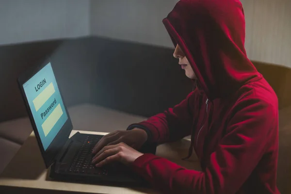 Dangerous hooded woman hacker breaks into personal data and infe