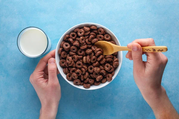 Chocolate, brown, glazed rings and a glass of milk for dry, heal — Stock Photo, Image