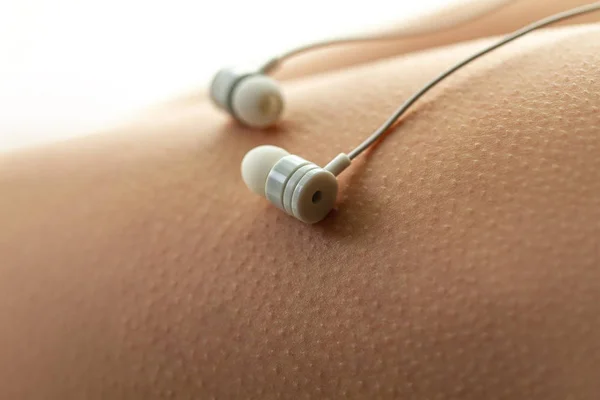 Music lover is having goosebumps, enjoying and feeling pleasure