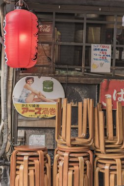 TOKYO, JAPAN - August 16 2018: Old vintage retro japanese metal signs and red rice paper lantern where it is written 