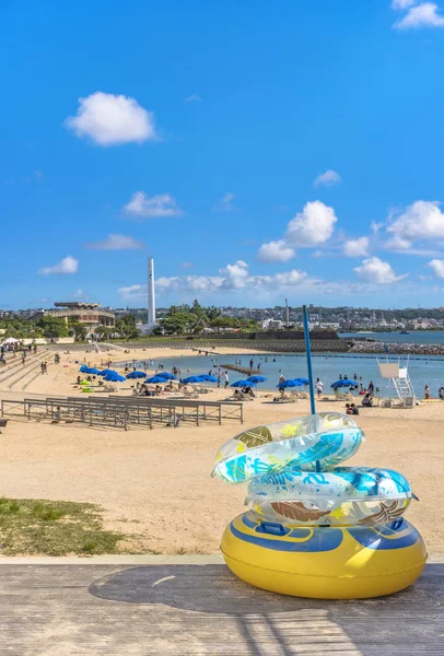 Beach umbrellas and palm trees on the Sunset beach in Chatan City in the American Village of Okinawa island in Japan. — Stock Image Beach Umbrellas Palm Trees Sunset Beach Chatan City American Village Stock Picture