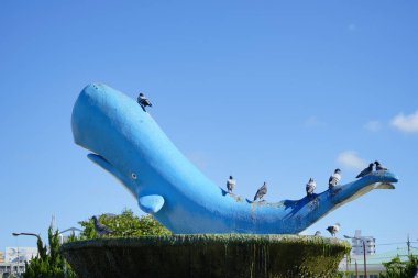Monument of the fountain in the shape of a whale clipart