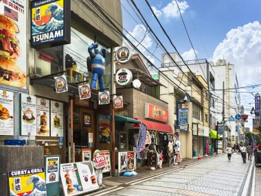 yokosuka, japan - july 19 2020: Dobuita entertainment district near Yokosuka naval base called Dobuita-dori shopping street famous among the sailors for its American style Burger fast food restaurants clipart