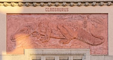 BERLIN, AUGUST 09: A wall surrounding the ZOO in Berlin, GERMANY 2017. Claosaurus in the rays of the setting sun. clipart